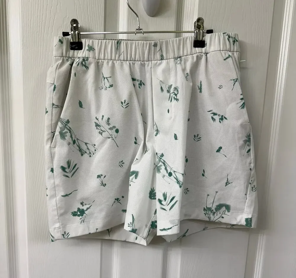 Lululemon Men's Medium swim shorts white base green floral print